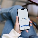 Person looking at the LinkedIn app on a smartphone 
