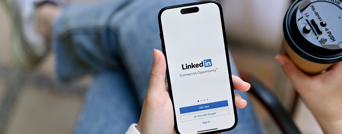 Person looking at the LinkedIn app on a smartphone 